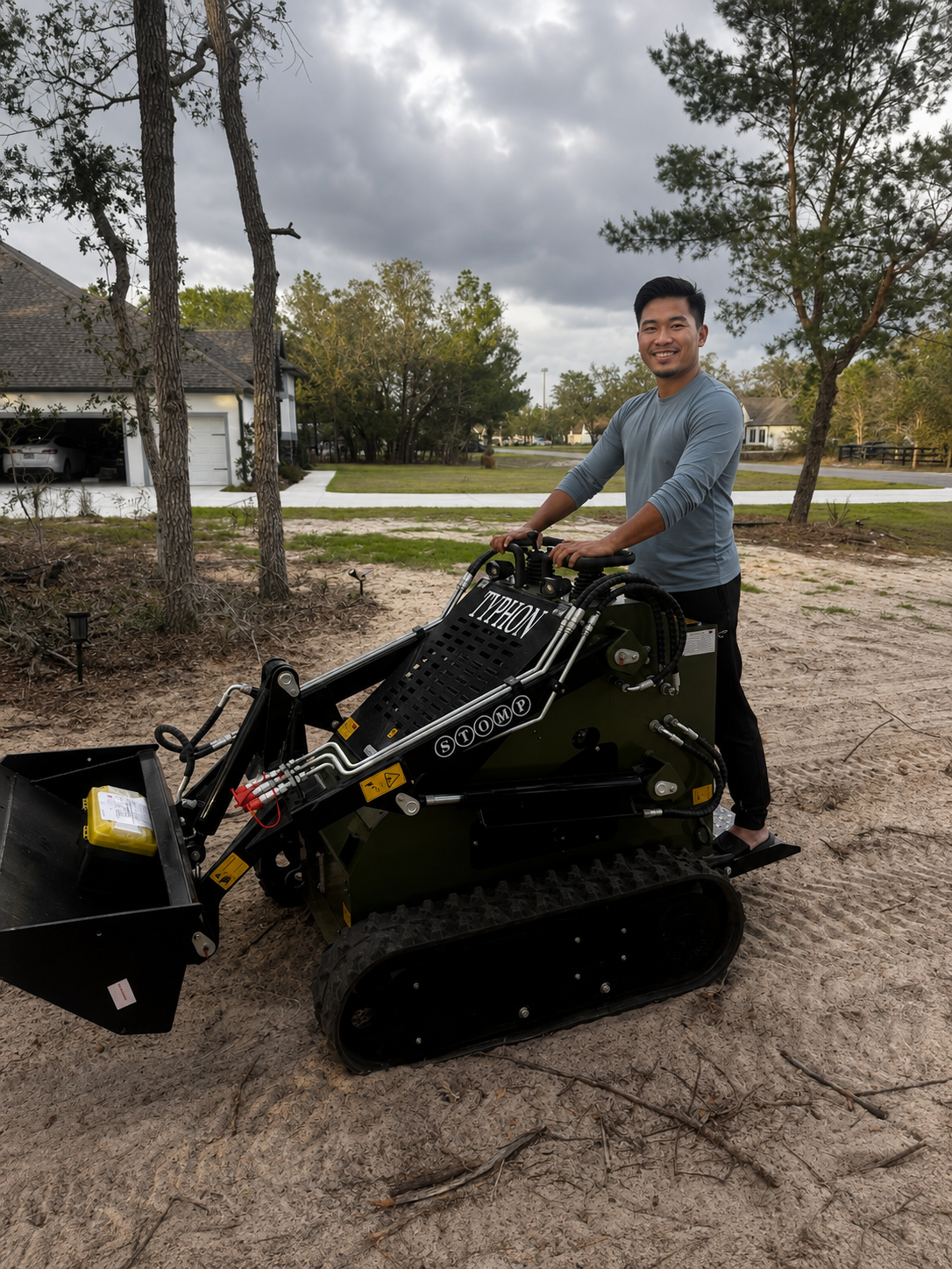 TYPHON skid steer loader shown in a real-world outdoor work environment
