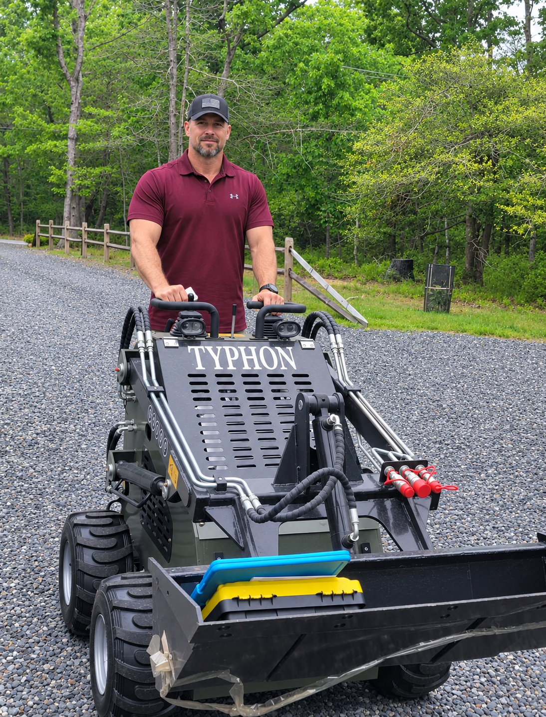 TYPHON compact skid steer loader working outdoors for property and contractor applications
